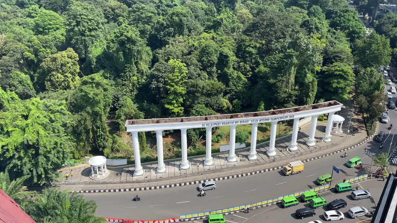 Botanical garden at the heart of city Bogor showing traffic and green forest of Bogor City under the blue sky