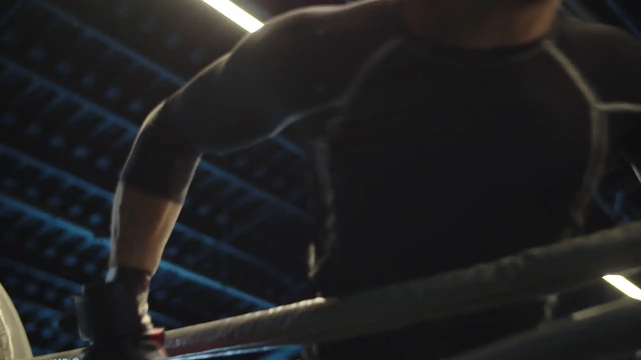 Angry sport man starting to attack at gym Boxer starting fight on boxing ring