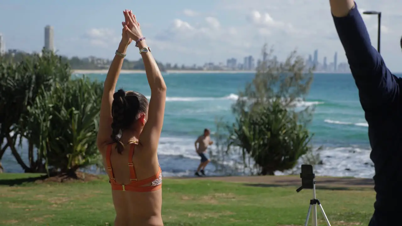 Yoga Instructor Stretching And Exercising At The Park Yoga At Beach Burleigh Heads Beach In Summer Gold Coast Queensland Australia