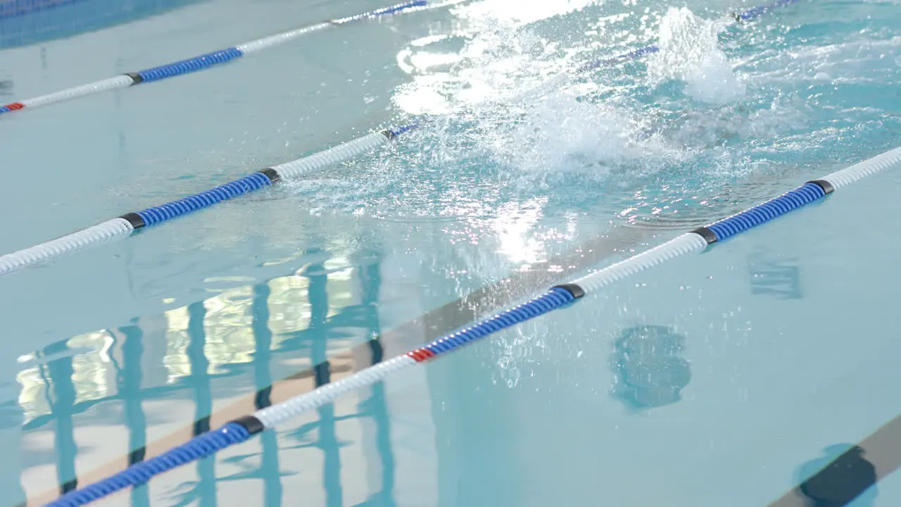 Swimmer in action at a pool with copy space