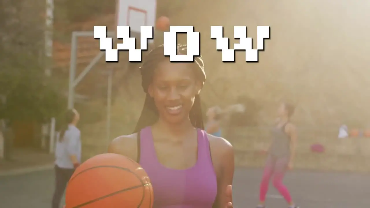 Wow text against portrait of african american woman holding basketball at basketball court