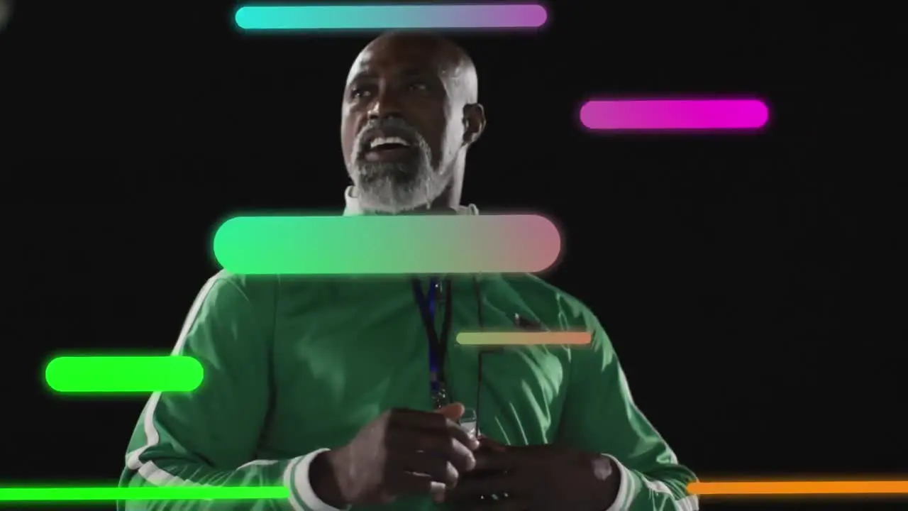 Animation of colourful shapes over african american sports coach checking stopwatch