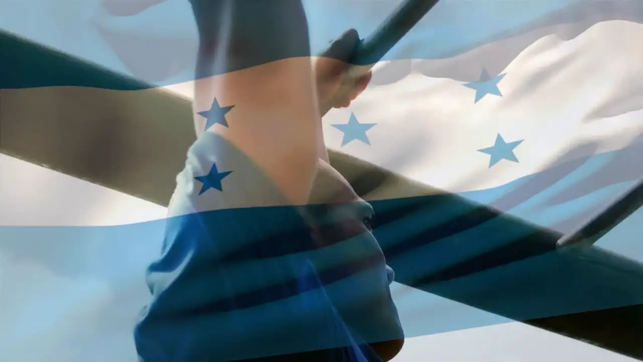 Animation of flag of honduras over strong muscular man doing pull ups