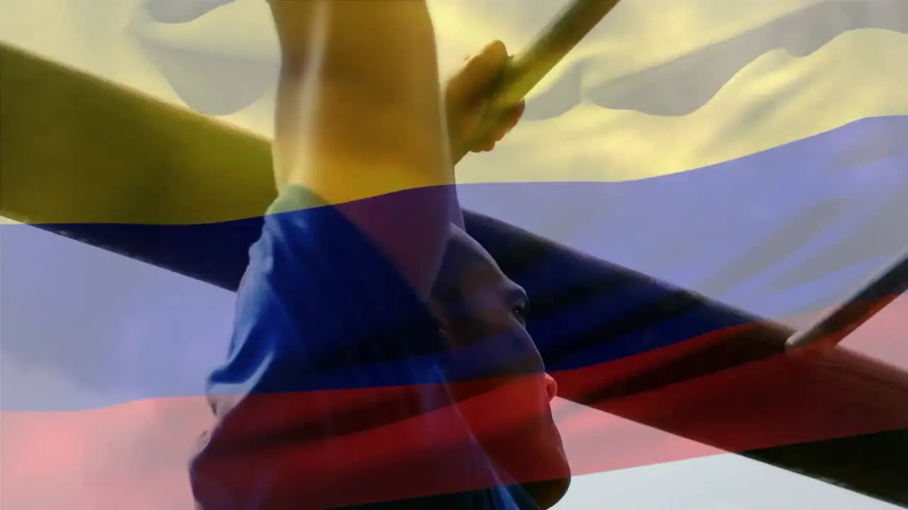 Animation of flag go columbia over strong muscular man doing pull ups