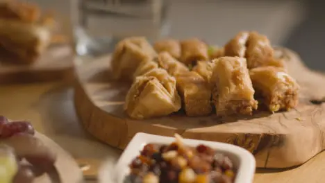 Close Up Of Food On Muslim Family Table In Home Set For Meal Celebrating Eid 6