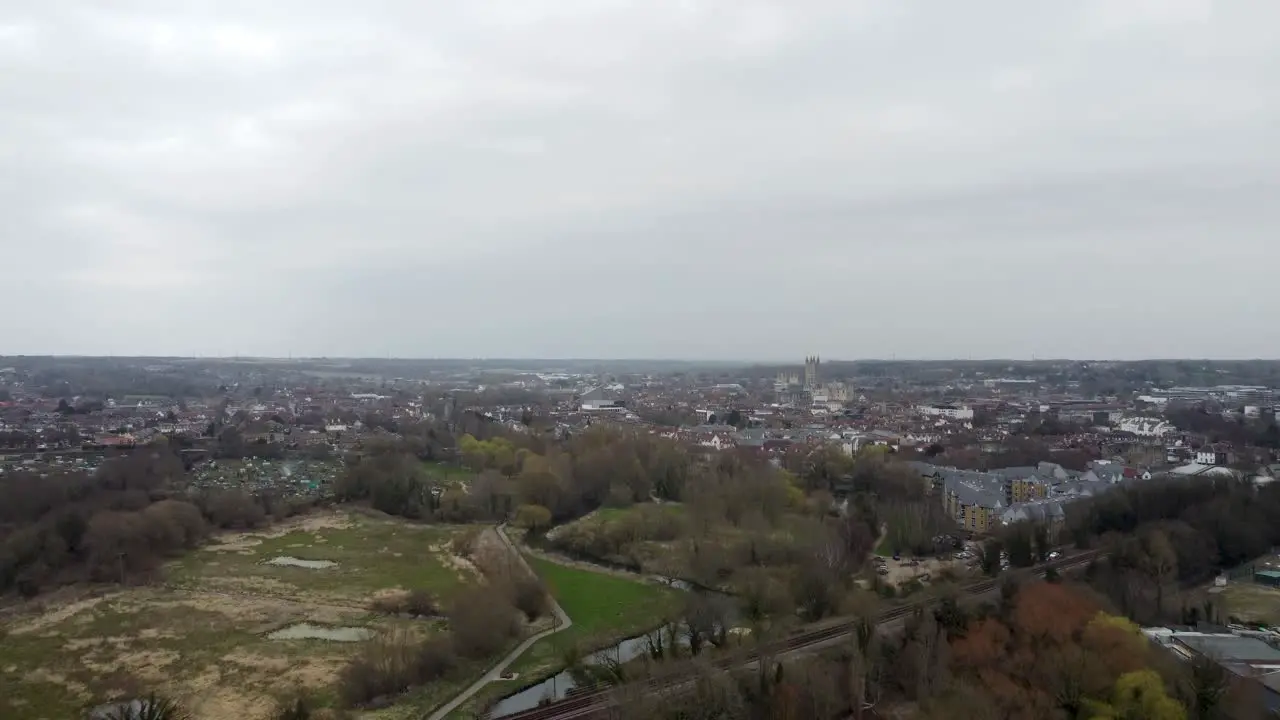 A rising drone shot over a town in England with the Stour river