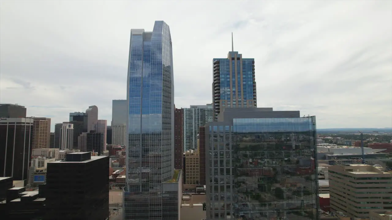 Drone slow rising among skyscrapers in the city of Downtown Denver Colorado USA