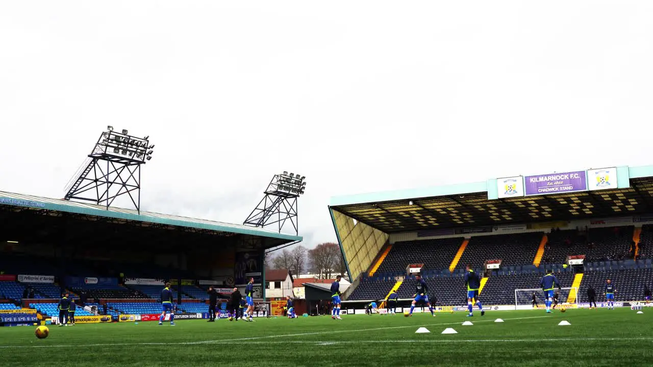 Typical Professional Scottish Soccer game where players are warming-up before the game starts