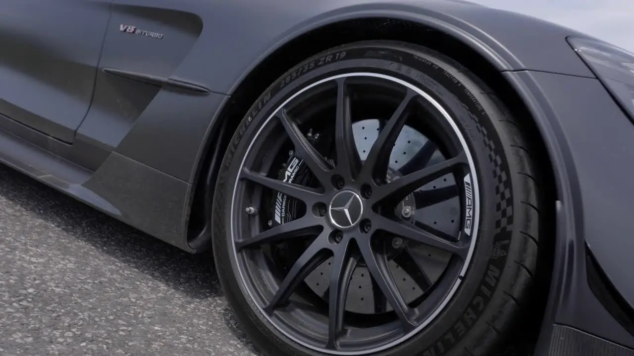 Camera Rotates and Zooms Towards the Tire and the Mercedes Benz Logo