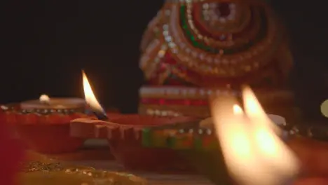 Close Up Of Burning Lamps And Decorations Celebrating Festival Of Diwali