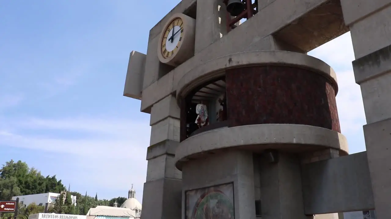 Bell tower with saint inside moving hands at Mexico