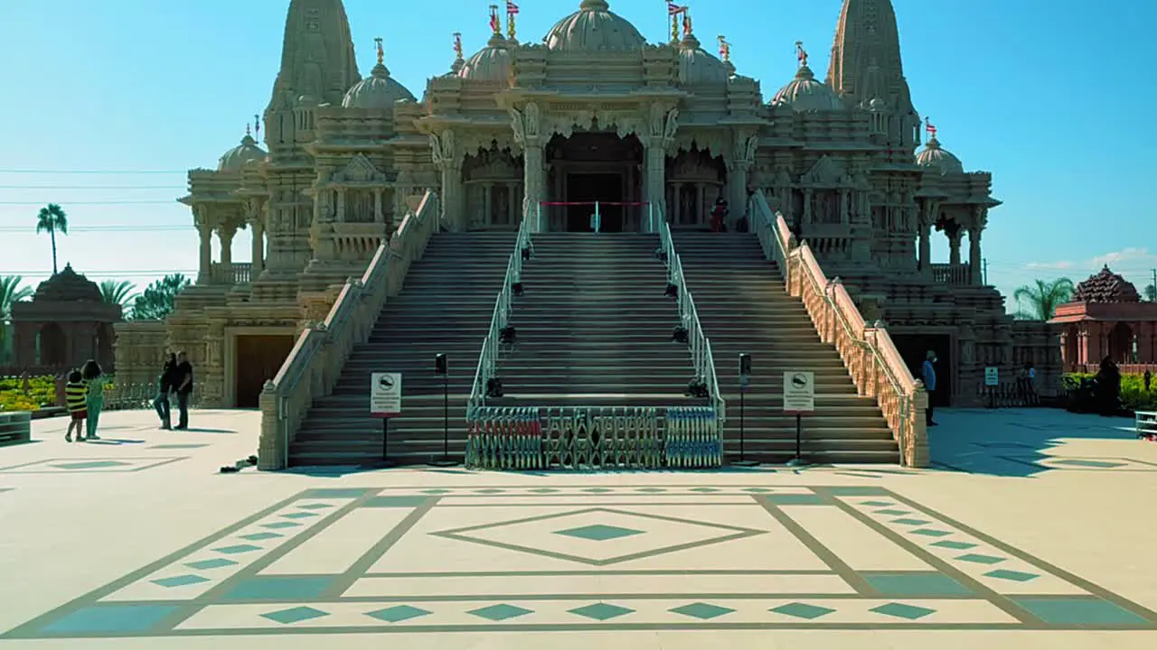 Panning up close up shot of the front of the BAPS Shri Swaminarayan Mandir Hindu temple in Chino California