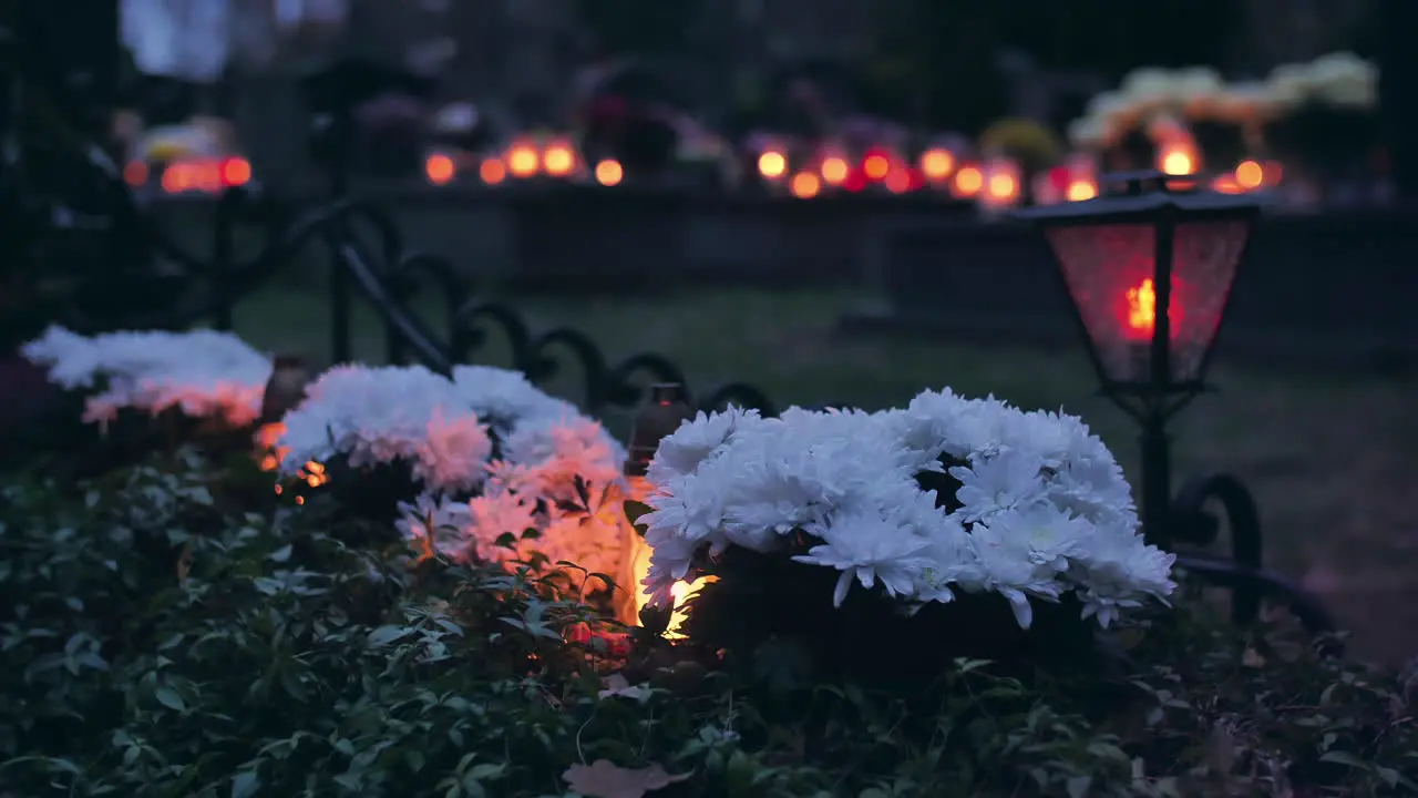 Flowers and burning candles on a grave