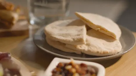 Close Up Of Food On Muslim Family Table In Home Set For Meal Celebrating Eid 5