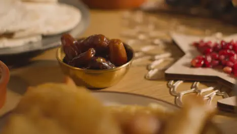 Close Up Of Food On Muslim Family Table In Home Set For Meal Celebrating Eid 9