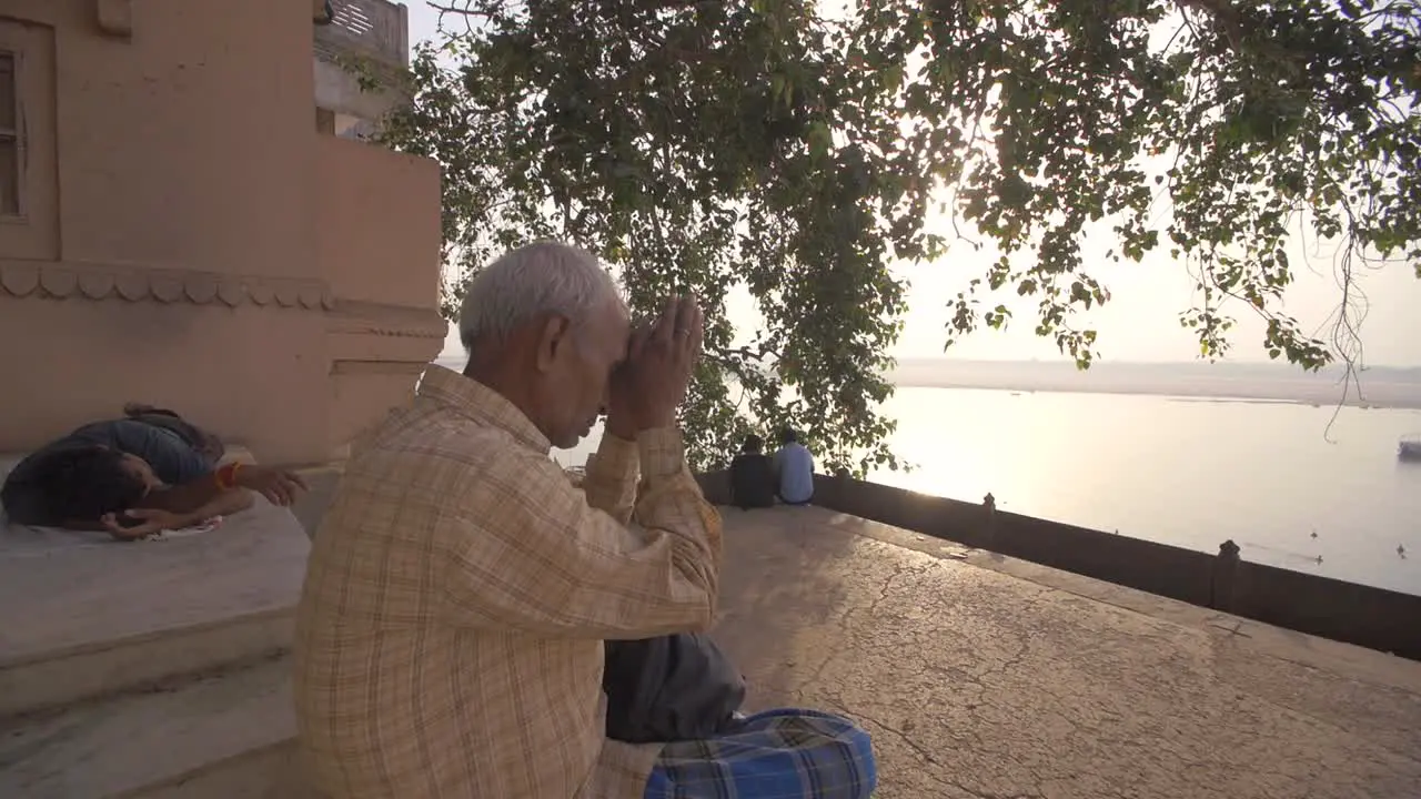 Elderly Man Praying Near the Ganges