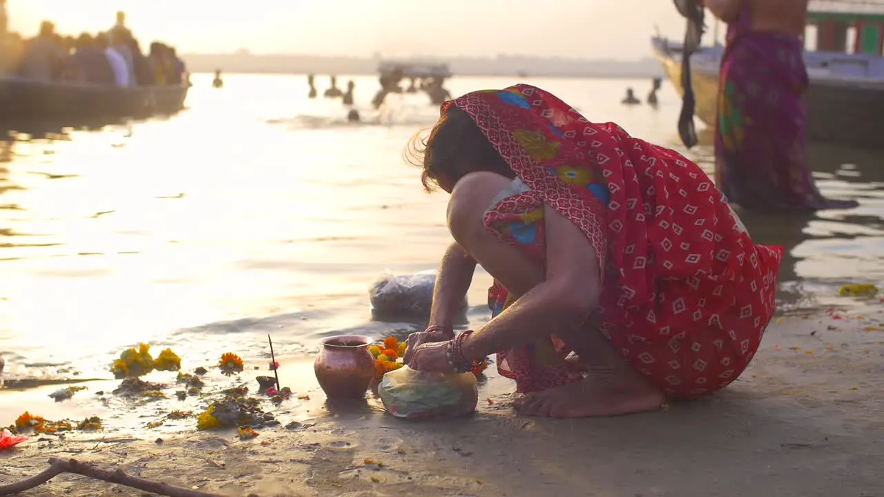 Crouching Indian Woman Sorts Marigold Flowers