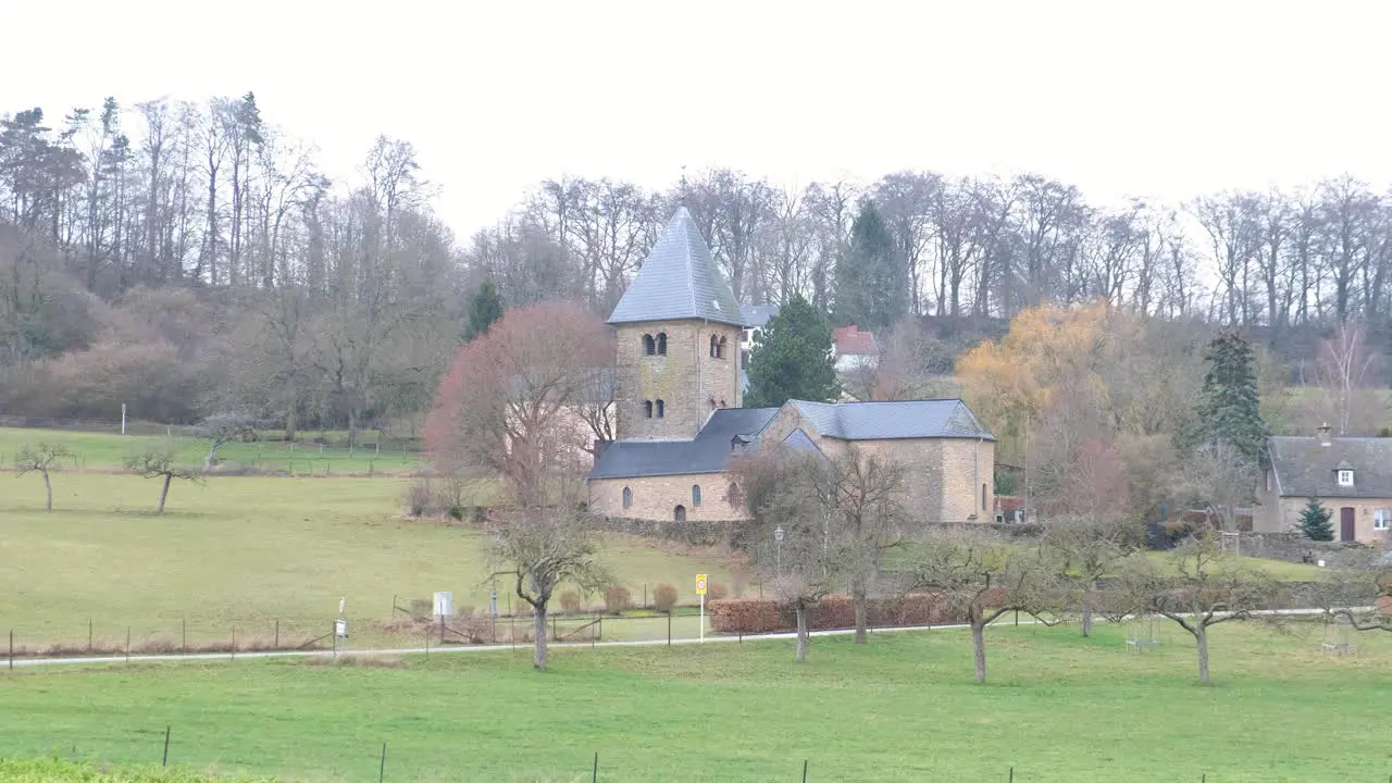 Pan over the small village of Girsterklaus in Luxembourg with its medieval chapel