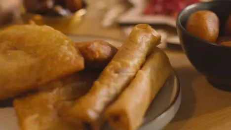 Close Up Of Food On Muslim Family Table In Home Set For Meal Celebrating Eid 1