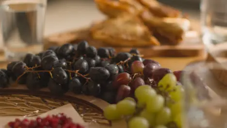 Close Up Of Food On Muslim Family Table In Home Set For Meal Celebrating Eid 8