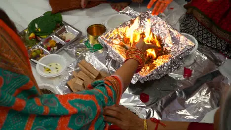 Close Up Of Worshippers Offer Smaghri Into Fire In Havan Ceremony For Navratri 1