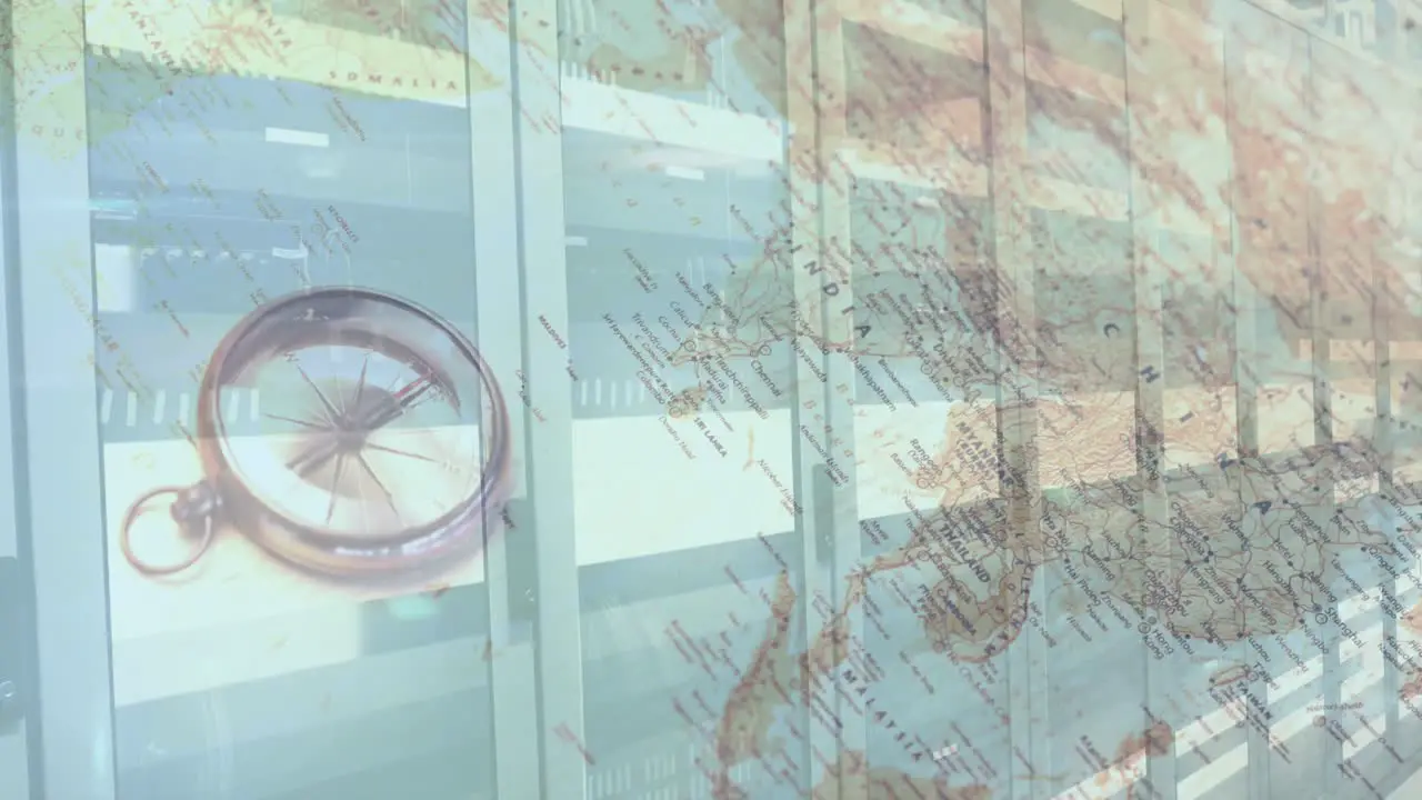 Digital composition of compass and world map against computer server room