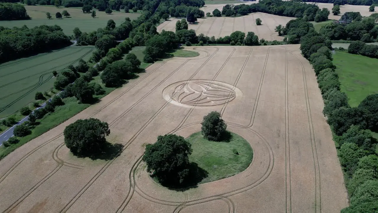 Establishing aerial view towards Warminster 2023 crop circle farmland alongside A36 highway