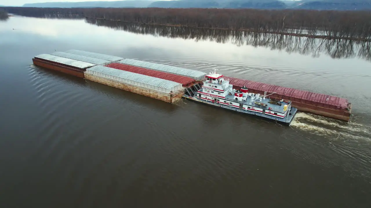 A towboat pushes barges north on the Mississippi River-3