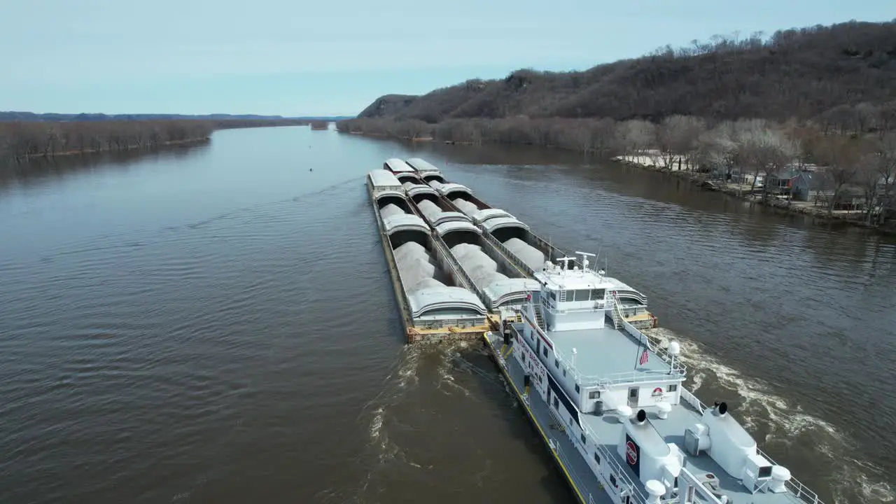 A towboat pushes barges north on the Mississippi River-6