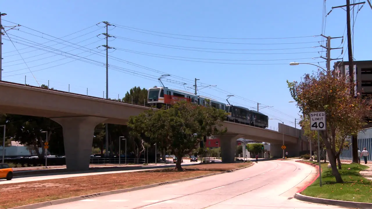 Rapid transit train on elevated railway moves through Los Angeles