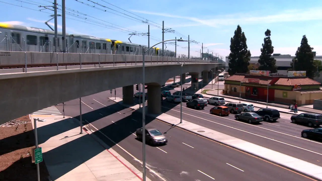 Rapid transit train on elevated railway moves through Los Angeles 1