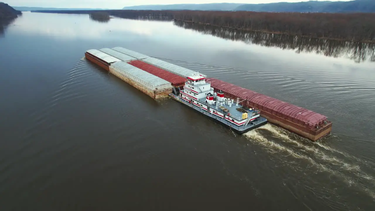 A towboat pushes barges north on the Mississippi River-2