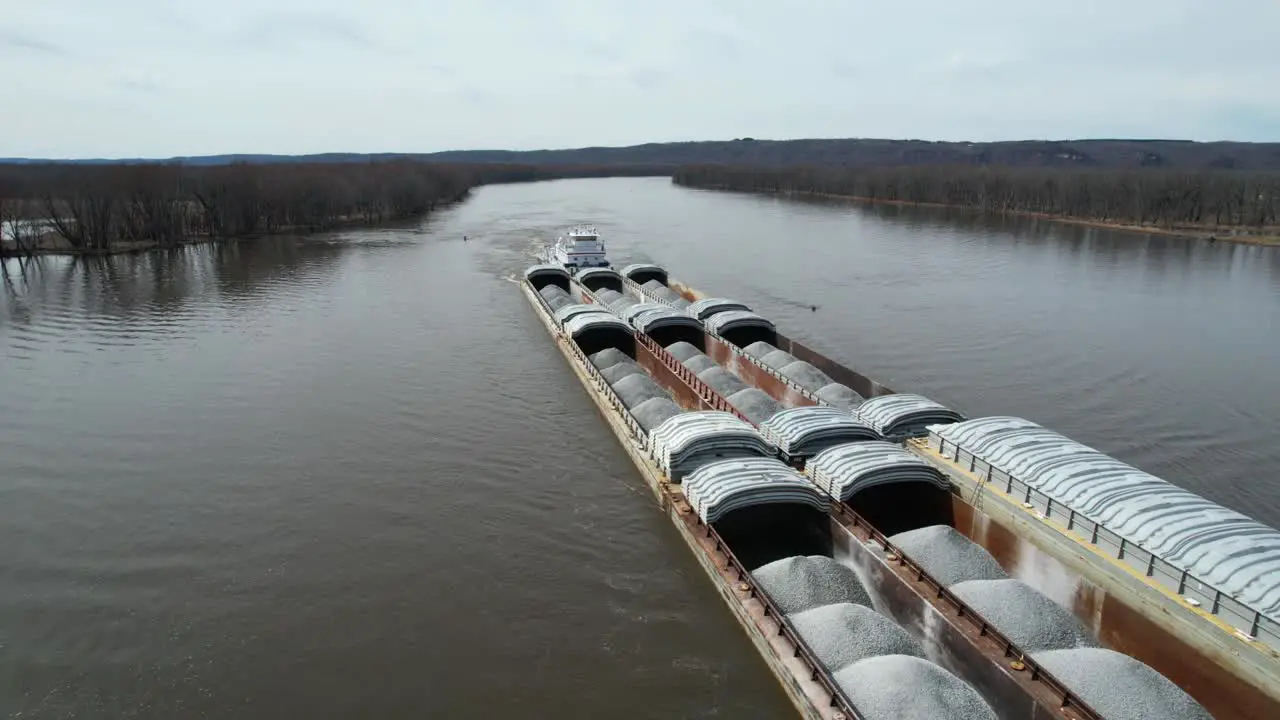 A towboat pushes barges north on the Mississippi River-1