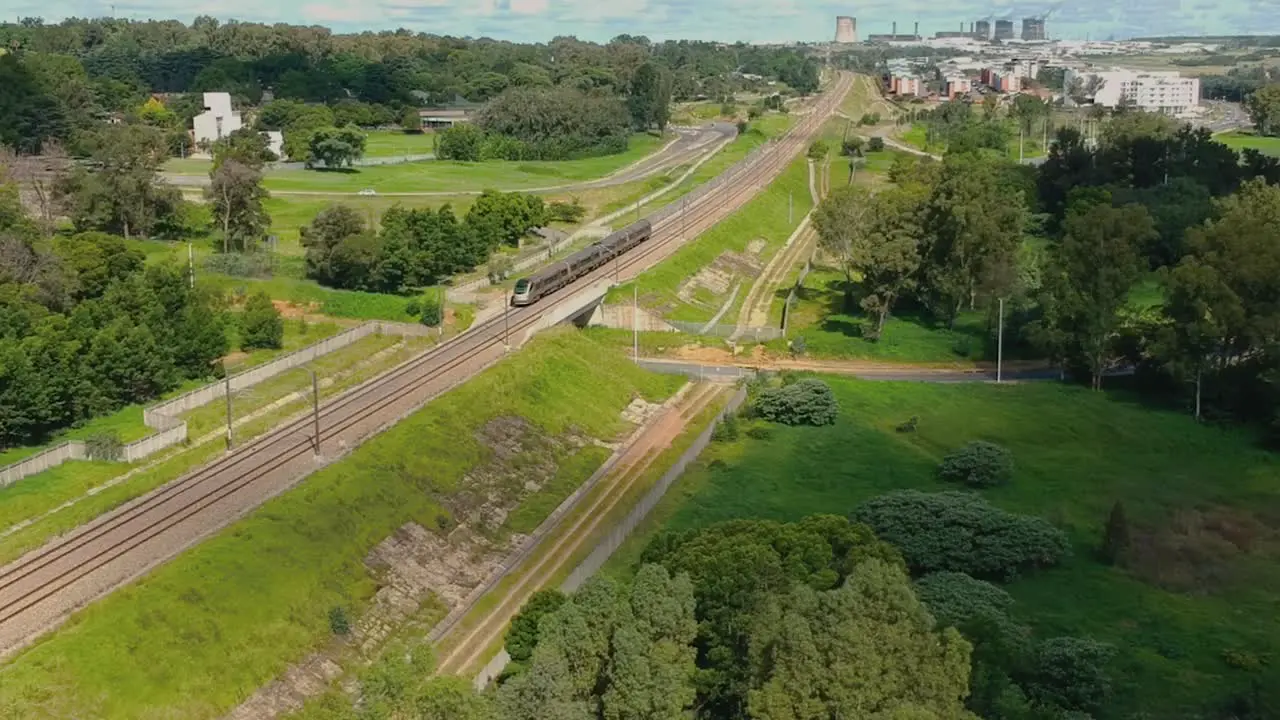 Elevated drone shot of train passing by