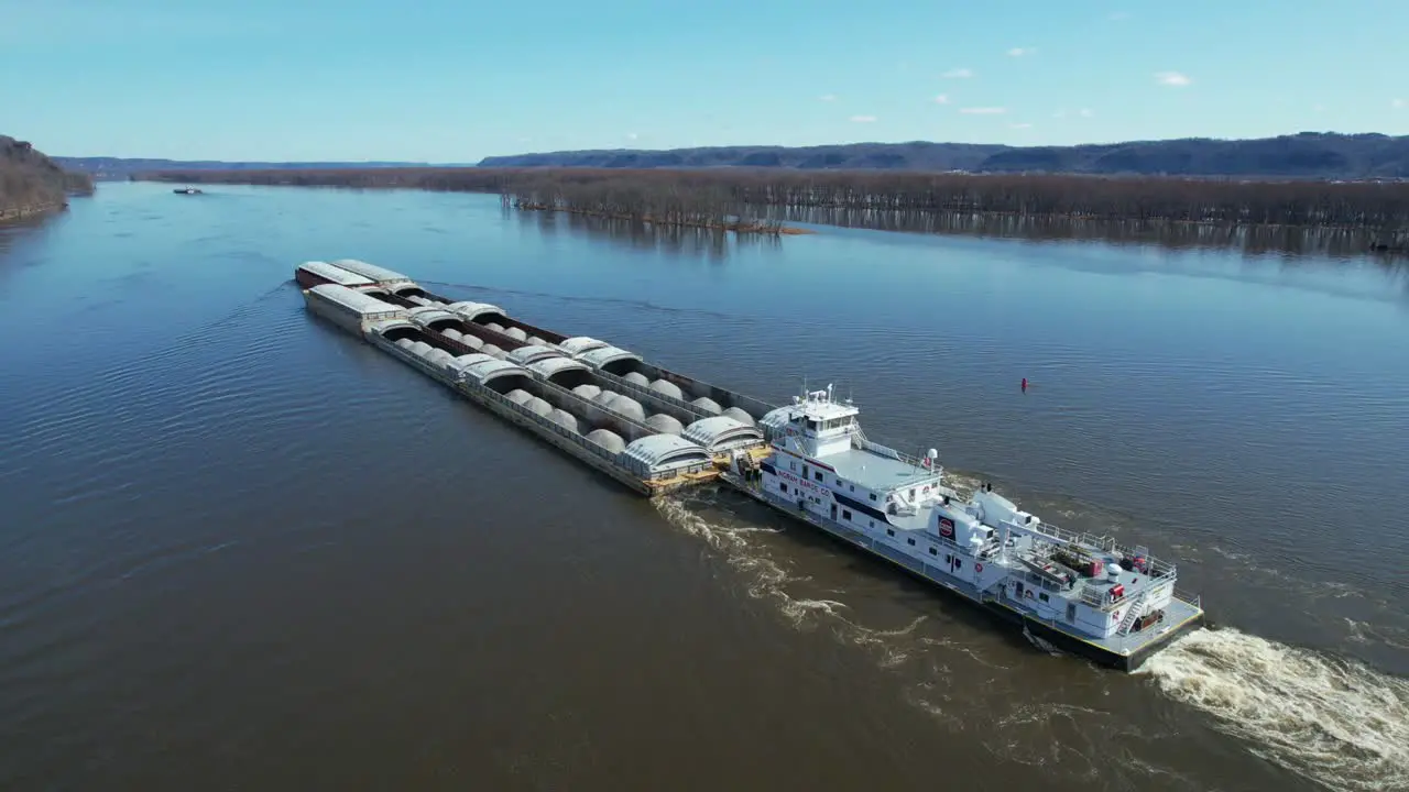 A towboat pushes barges north on the Mississippi River-5