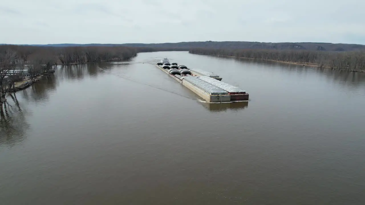 A towboat pushes barges north on the Mississippi River-4