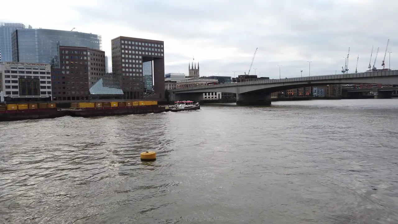 Tug boat working on river Thames in centre of London