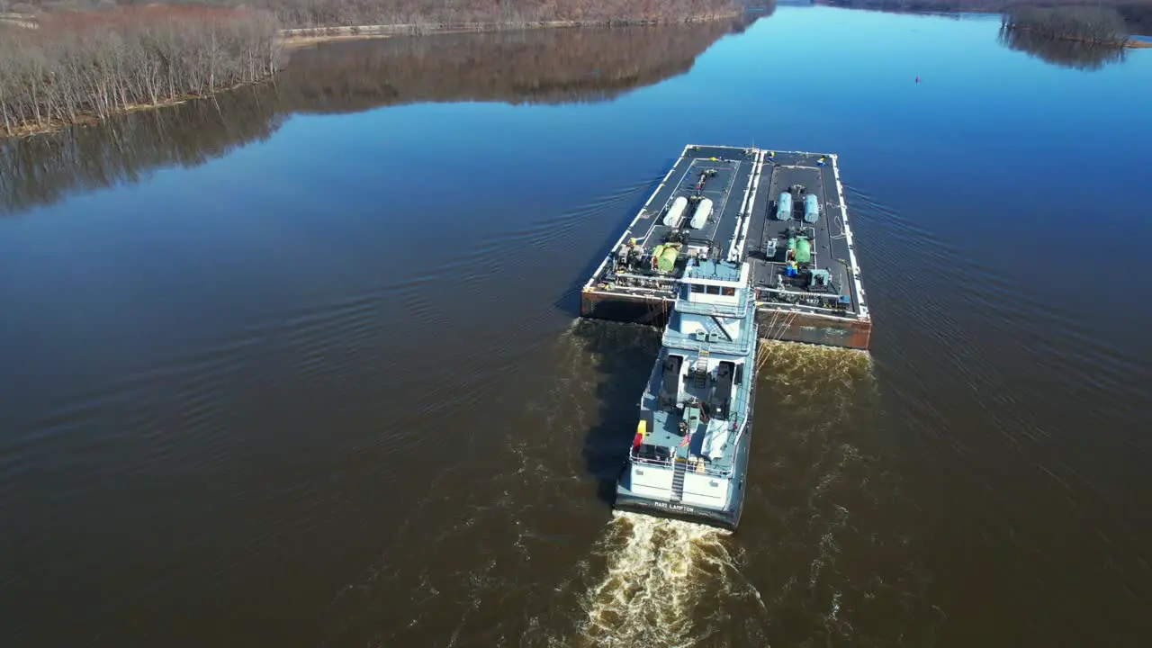 A towboat pushes fuel barges north on the Mississippi River-1