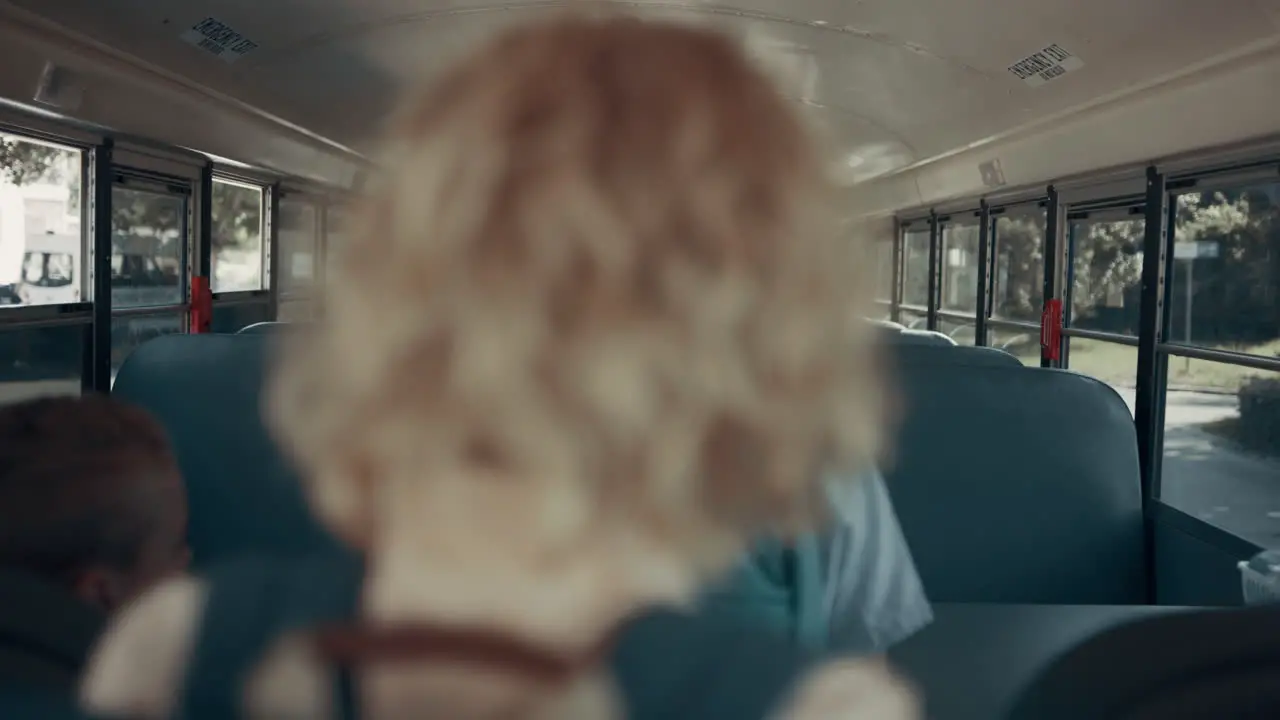 Teen school children boarding on empty shuttle Pupils taking seats in transport