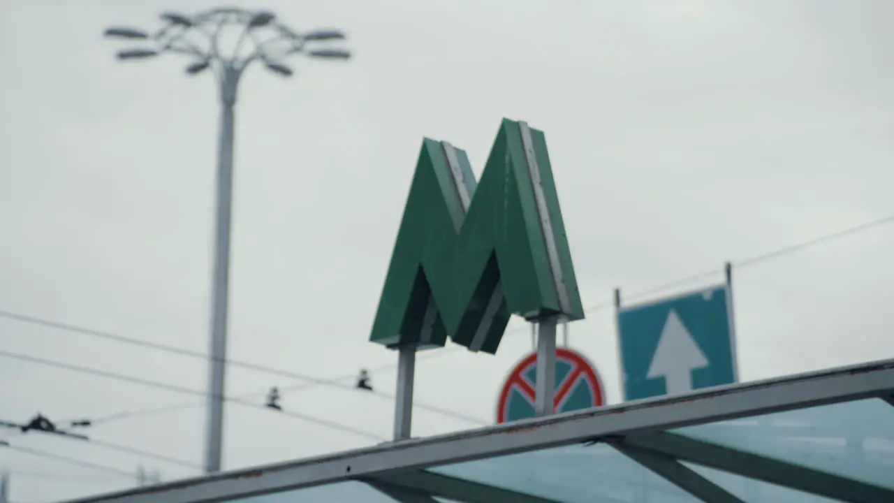 Metro sign underground station entrance to the subway in urban city