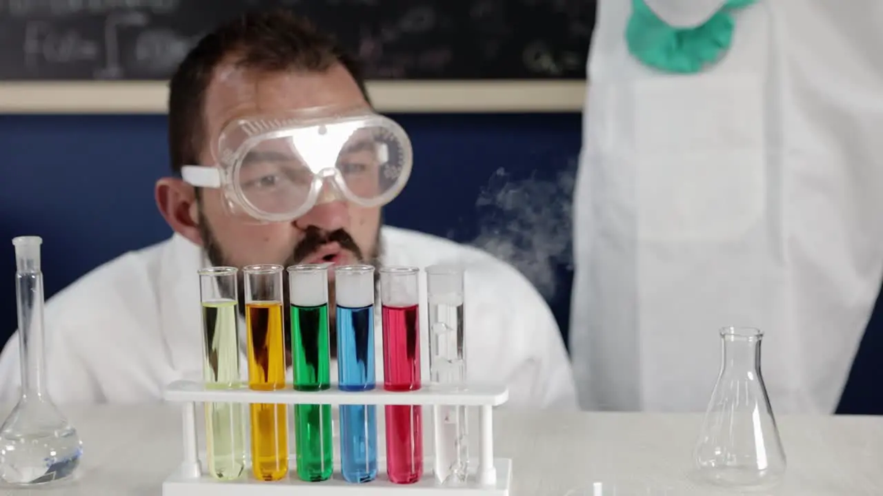 In a methodical display a scientist closely observes bubbling test tubes reflecting the meticulous nature of research and the dynamic dance of chemical interactions in progress