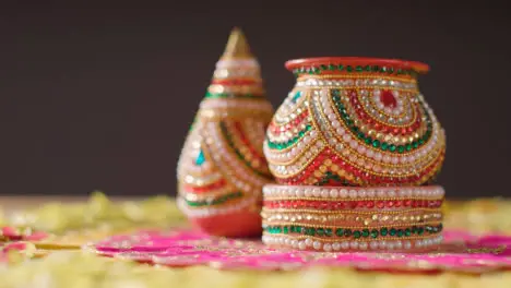 Traditional Coconut Pots On Table Decorated For Celebrating Festival Of Diwali