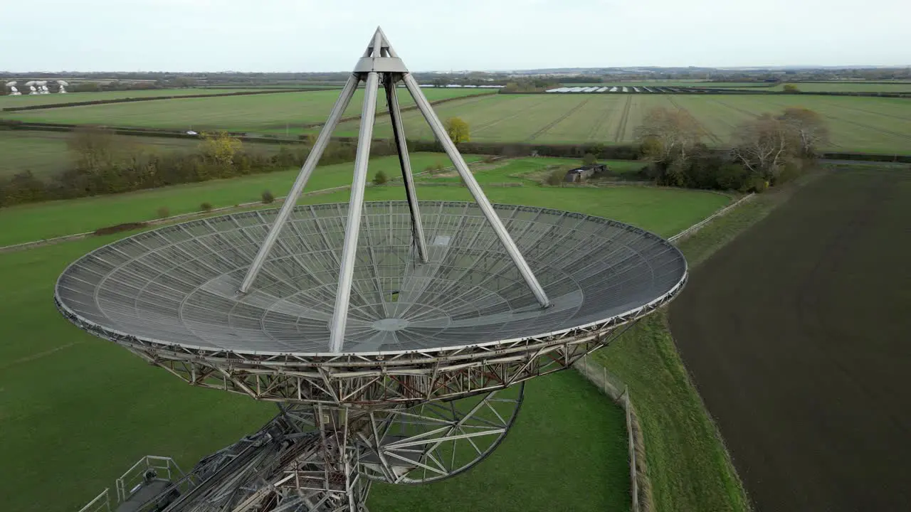 Aerial view orbiting Mullard MRAO radio observatory telescope in Cambridge countryside