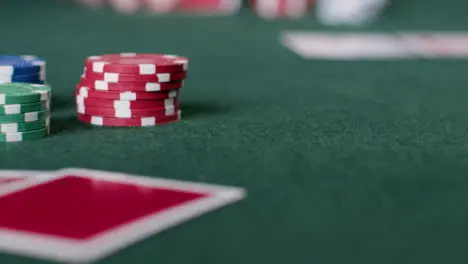 Sliding Shot of Pair of Cards and Poker Chips 