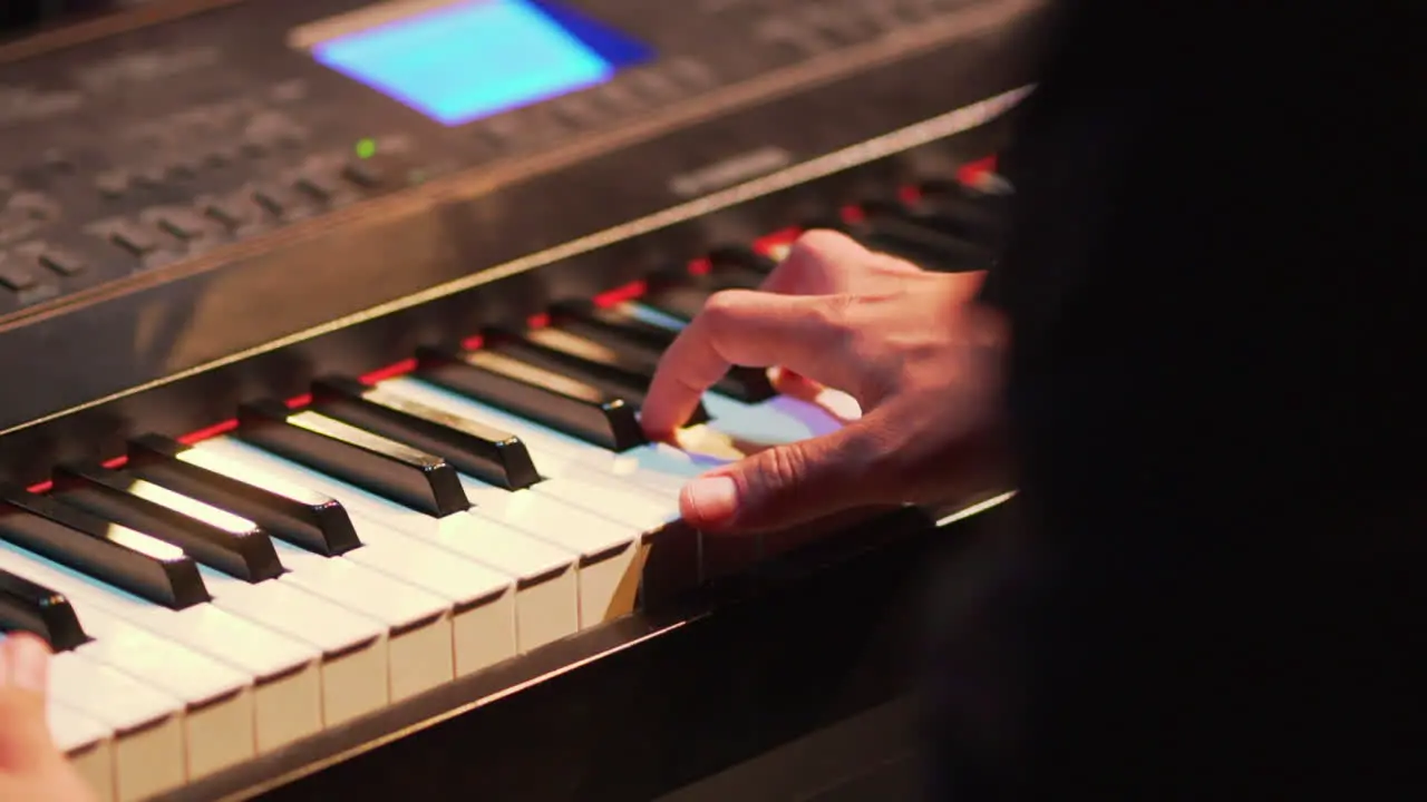 Keyboard player performing at concert