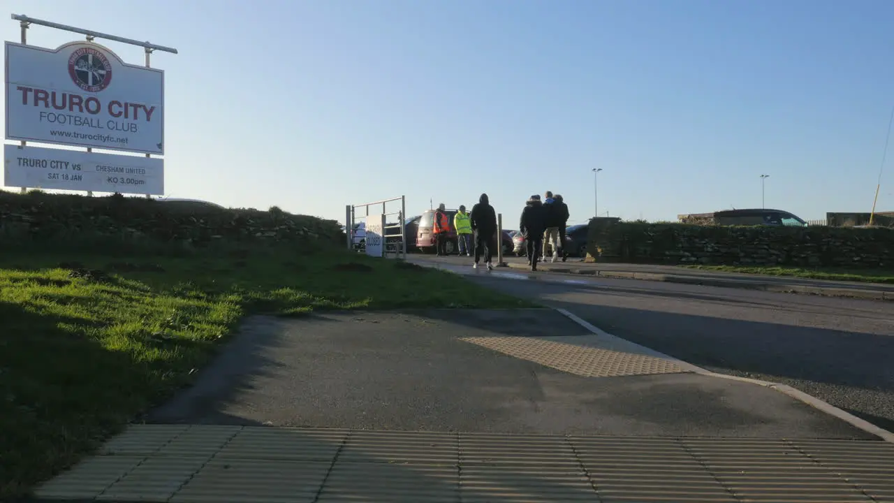 Football fans walking into the Truro City Football Club grounds on Match day