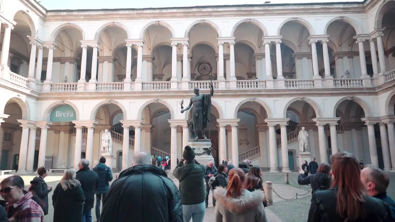 People Tourists Visit the Pinacoteca in Milan historic theater complex cultural meeting place in the Brera neighborhood