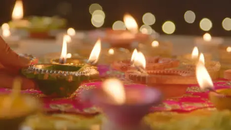 Person Holding Burning Lamp Celebrating Festival Of Diwali