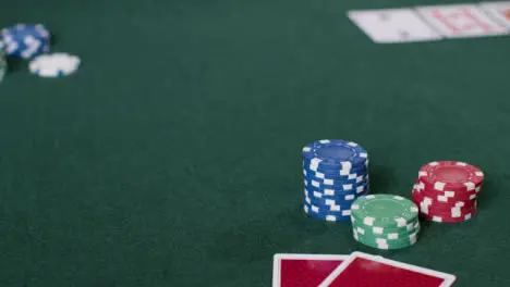 Pull Focus Shot from Poker Hand and Chips to Flop