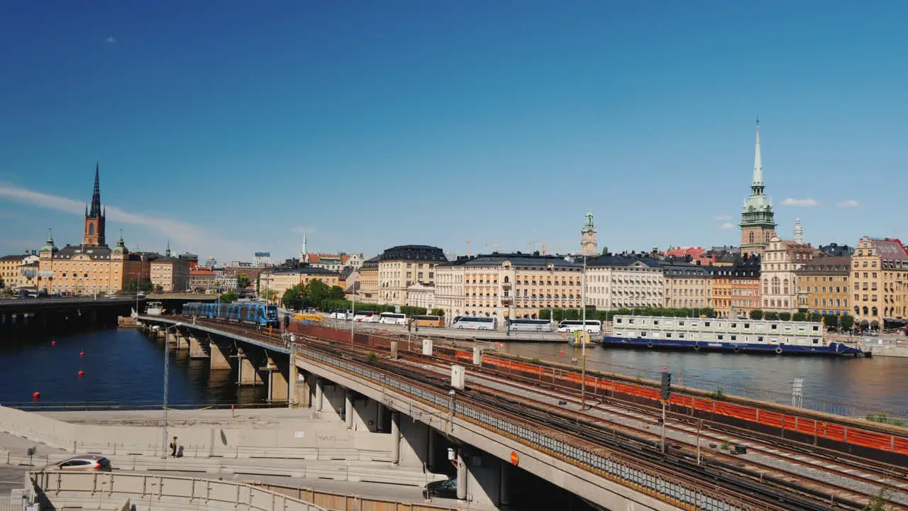 Subway Train Travels Across The Bridge Against The Backdrop Of The Stockholm City Line Sweden